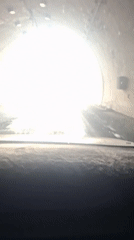 Driver traverses tunnel, emerges into Tajikistan mountain landscape