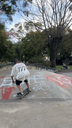 Skateboarder in numbered shirt filmed at Buenos Aires park