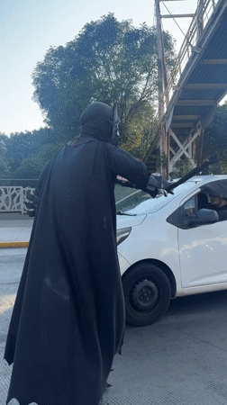 Batman-costumed person directs traffic in Puebla, Mexico
