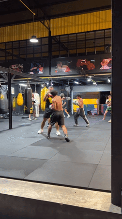 Sparring session and street motorcycles at a Chalong gym
