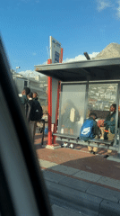 Students gather at Cape Town bus stop near Lion's Head