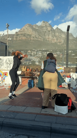 Students gather at Cape Town bus stop near Lion's Head