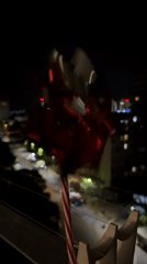 Nighttime urban scenes captured with spinning pinwheel and illuminated building