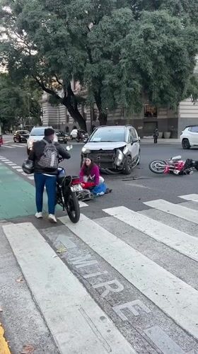Car-motorcycle collision damages vehicles at Buenos Aires intersection
