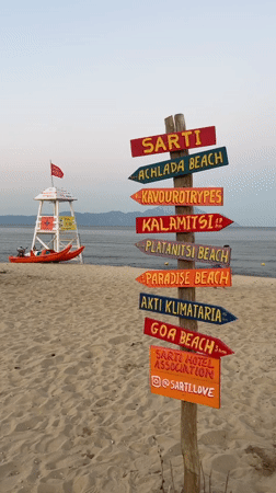 Dusk settles over a quiet beach in Toroni, Greece