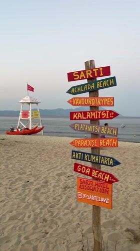 Dusk settles over a quiet beach in Toroni, Greece