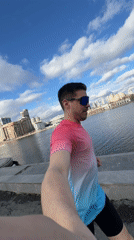 Man takes selfies by Iset River in Yekaterinburg