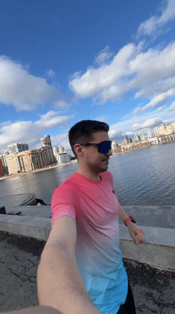 Man takes selfies by Iset River in Yekaterinburg