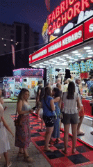Outdoor food court and arcade games on a July evening in Quarteira