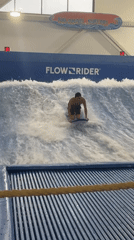 Late-night bodyboarding session at indoor surf park