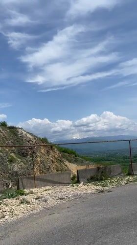 Morning drive captures rural Georgian roads, barriers, grazing livestock
