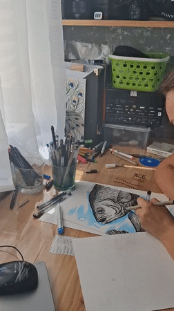 Artist creates detailed fish illustration in Kempelevo studio