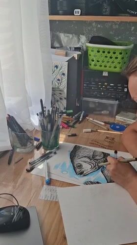 Artist creates detailed fish illustration in Kempelevo studio