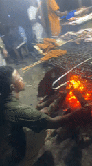 Nighttime street food grilling operation documented in Port Harcourt