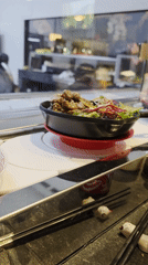 Late-night sushi restaurant scene captured in Ensenada