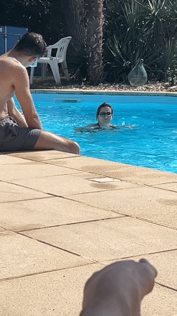 Lazy summer afternoon around a backyard pool in Saint-Galmier