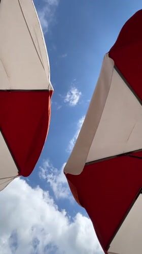 Kuta beach hangout: umbrellas, beanbags, and breaking waves