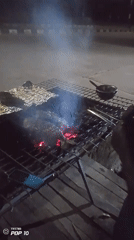 Nighttime street food grilling documented in Gura Top, Nigeria