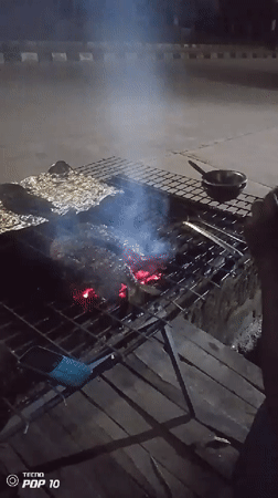 Nighttime street food grilling documented in Gura Top, Nigeria