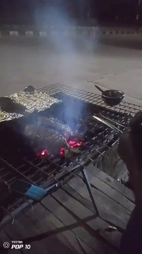 Nighttime street food grilling documented in Gura Top, Nigeria