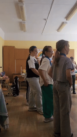 Students gathered in a fluorescent-lit classroom in Chaikovsky, Russia