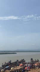 Passenger boat crosses river in Lokoja Nigeria morning