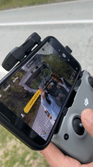 Drone filming session captures woman and car on Montenegro mountain road