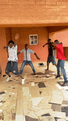 Young men perform synchronized dance in Nigeria outdoor venue