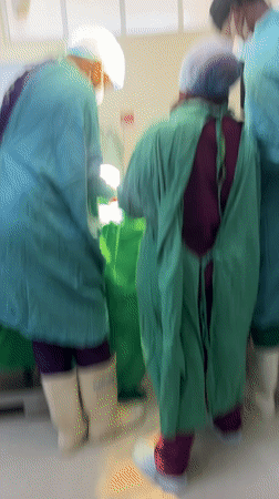 Medical team in surgical gear observed in Nairobi operating room