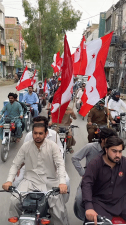 Motorcycle procession with political flags rolls through central Quetta