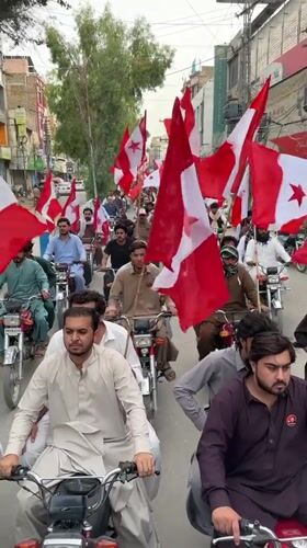 Motorcycle procession with political flags rolls through central Quetta