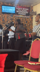 Church service with gospel choir and speaker in Madangala