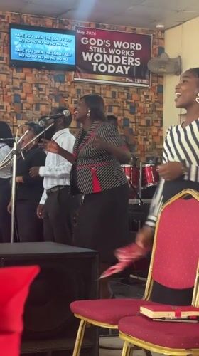 Church service with gospel choir and speaker in Madangala