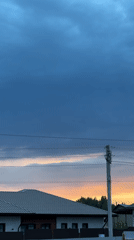 Dramatic storm clouds and sunset observed over Kharnavy, Russia