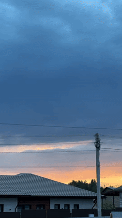 Dramatic storm clouds and sunset observed over Kharnavy, Russia