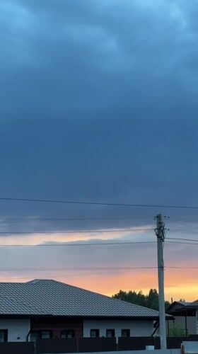 Dramatic storm clouds and sunset observed over Kharnavy, Russia