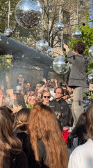 Outdoor dance party with disco balls draws crowds in Moscow