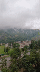Misty morning in Karachayevsk with mountains looming over town