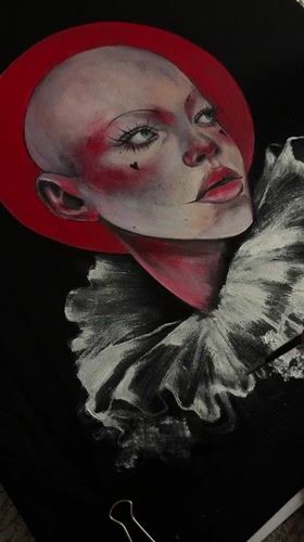 Artist creates bold clown portrait, from paper to painted hoodie