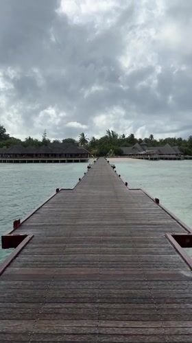 Wooden pier captured in tropical Maldives waters