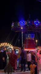 Nighttime carnival operates in Dhaka with illuminated rides, toy stalls