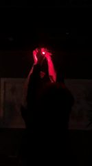DJ performs in dimly lit brick venue in Russia