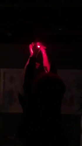 DJ performs in dimly lit brick venue in Russia