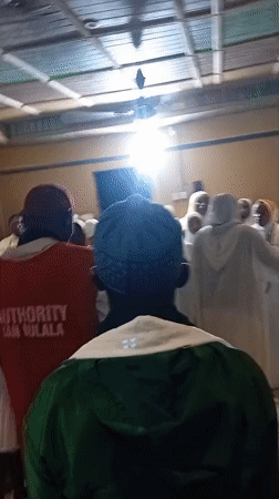 Religious gathering in Ajibo, Nigeria, attendees in white