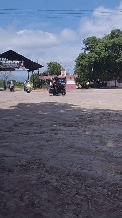 Three motorcycles travel dirt roads in Carora, Venezuela