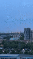 City skyline captured at dusk by multiple witnesses