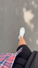 Person walks on asphalt path in Moscow