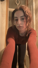 Woman observed in Moscow apartment drinking coffee, taking selfie