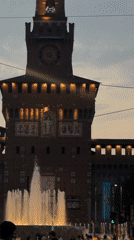 Castello Sforzesco at dusk, vintage tram in motion