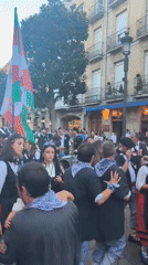 Basque flag flying high at a street celebration in Vitoria-Gasteiz
